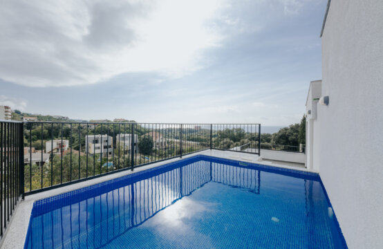 Three-story villa with a rooftop pool
